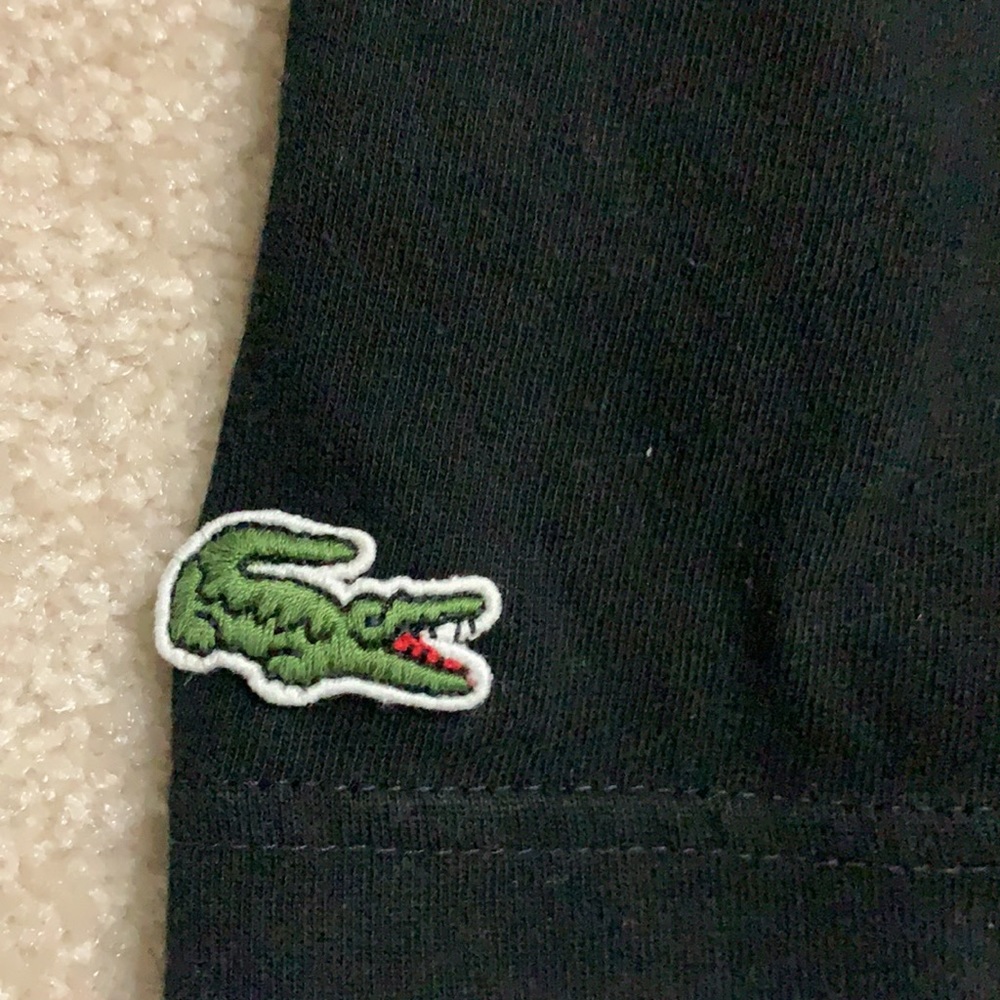 Lacoste Men’s black t-shirt.lShadow of alligator on front medium but fits small